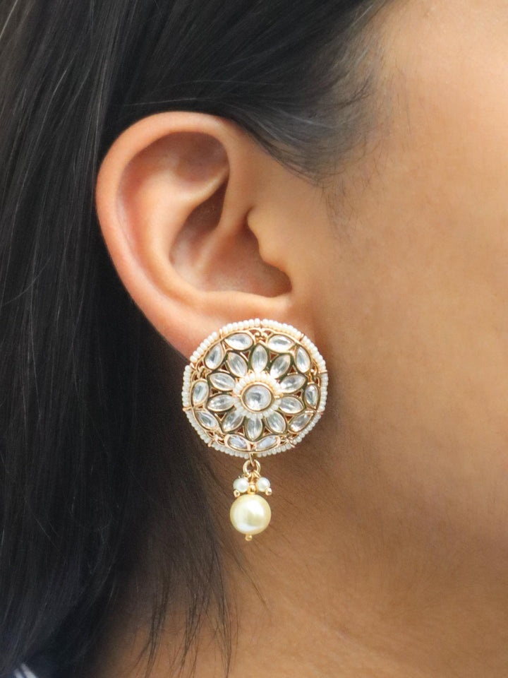 A closeup image of a girl wearing Motif Kundan Polki Dangler Earrings -1 by Live Some India 