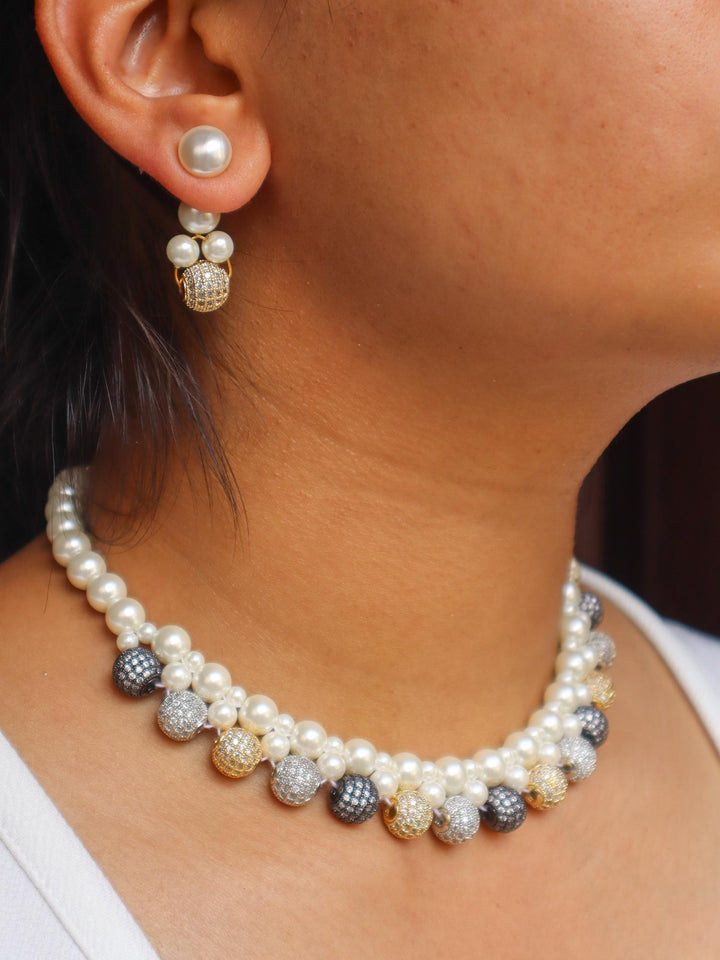 A closeup image of a girl wearing Multi Beaded White Pearl Necklace Set by Live Some India