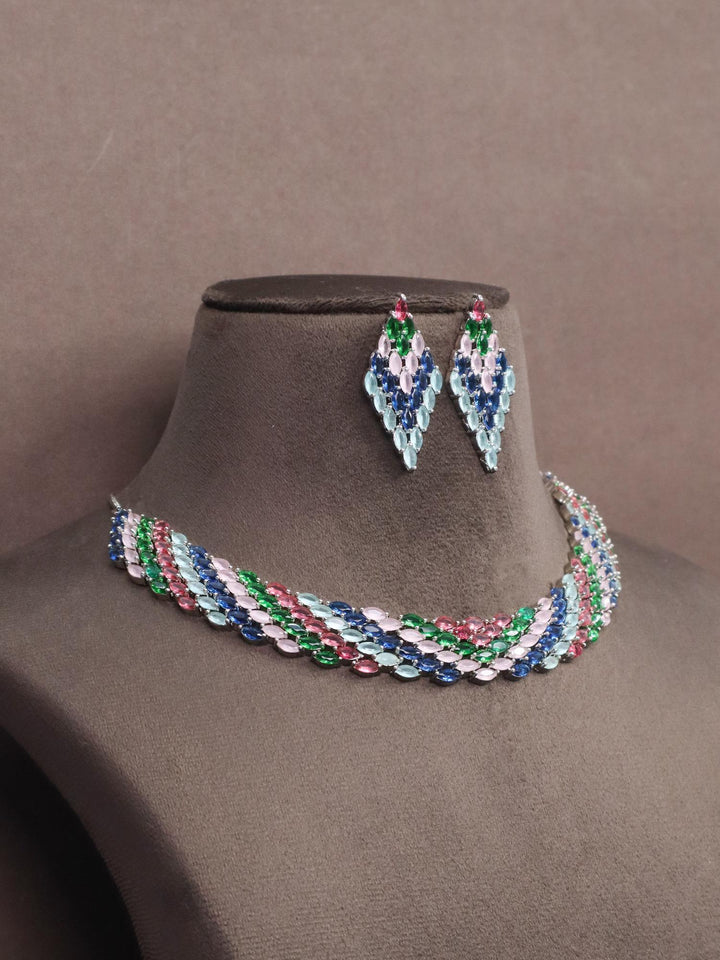 A closeup image of Multi Choker Diamond Necklace Set by Live Some India on a brown dummy 