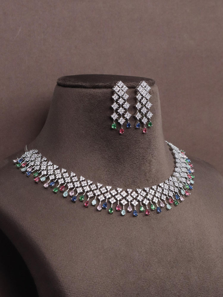 A closeup image of Multi Dangler Diamond Necklace set by Live Some India on a brown dummy 