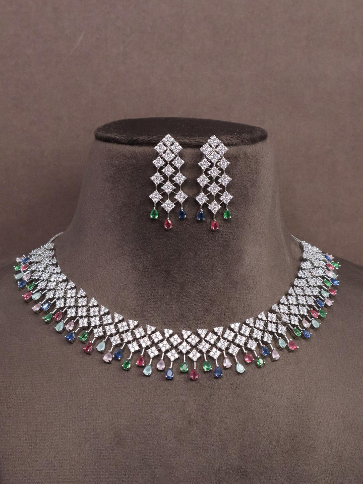 A closeup image of Multi Dangler Diamond Necklace set -1 by Live Some India on a brown dummy 