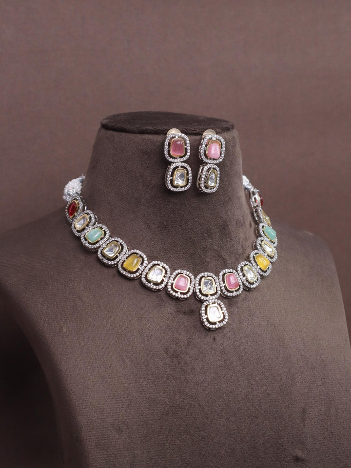 A closeup image of Multi Stone Kundan Polki Necklace Set  by Live Some India on a brown dummy 