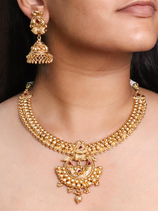 A closeup image of a girl wearing Mya Temple Jewellery by Live Some India 