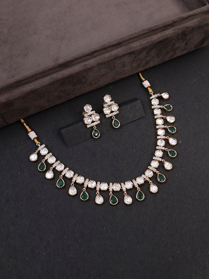 A closeup image of Myra Green Kundan Polki Necklace Set -2 by Live Some India on a black flatlay