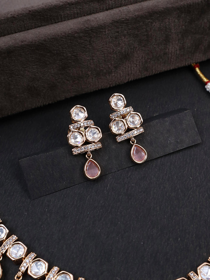 A closeup image of Myra Kundan Polki Earrings by Live Some India on a black background