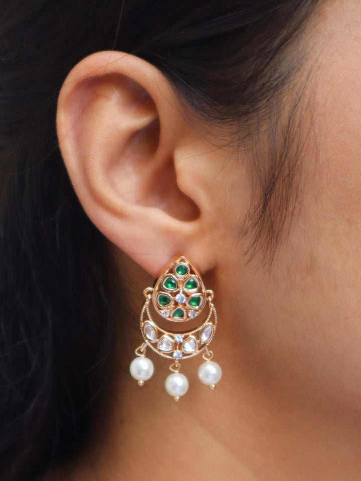 Girl wearing Myra Kundan Polki Small Dangle Earrings in Green by Live Some India