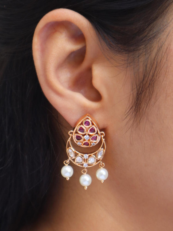 Girl Wearing Myra Kundan Polki Small Dangle Earrings in red by Live Some India