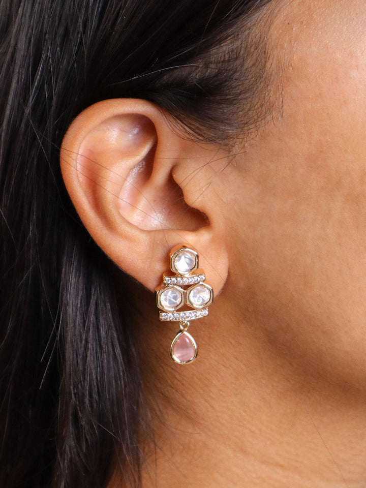 A closeup image of a girl wearing Myra Pastel Kundan Polki Earrings by Live Some India 