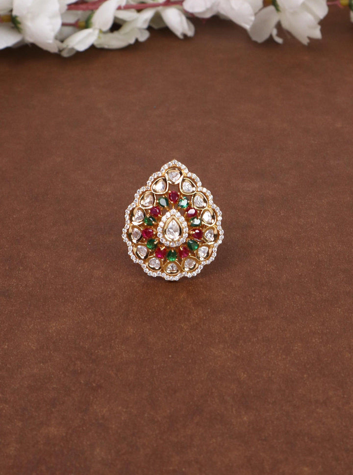 A closeup image of Naina Kundan Polki Multi Ring by Live Some India on a brown background