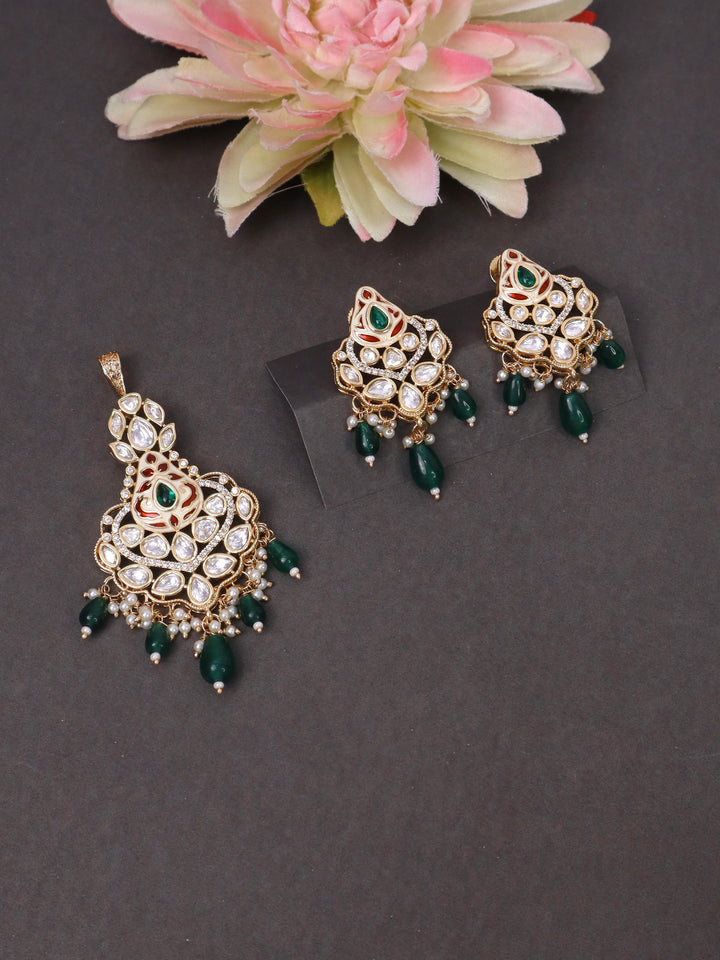 A closeup image of Nia Green Kundan Polki Pendant Set -4 by Live Some India on a black background 