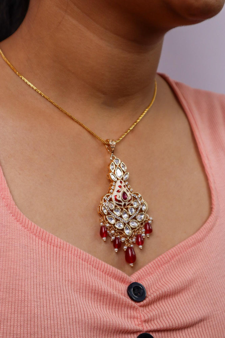 A closeup image of a girl wearing Nia Kundan Polki Red Pendant by Live Some India 