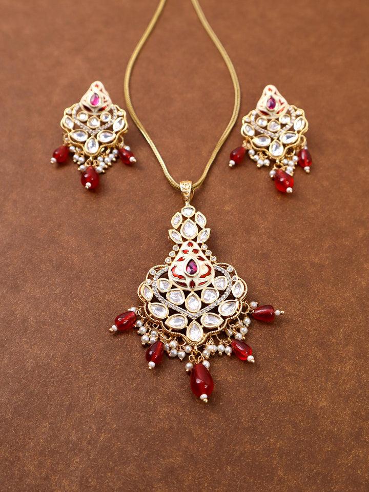 Nia Kundan Polki Red Stone Pendant Set by Live Some India on a brown background