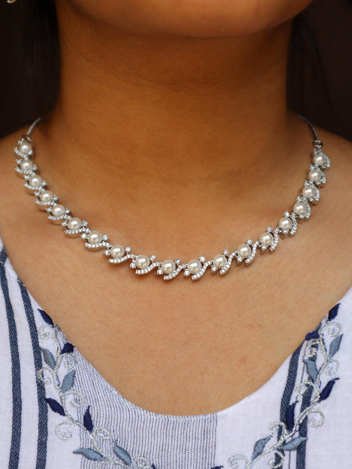 A closeup image of a girl wearing Nitara Pearl Necklace -1 by Live Some India