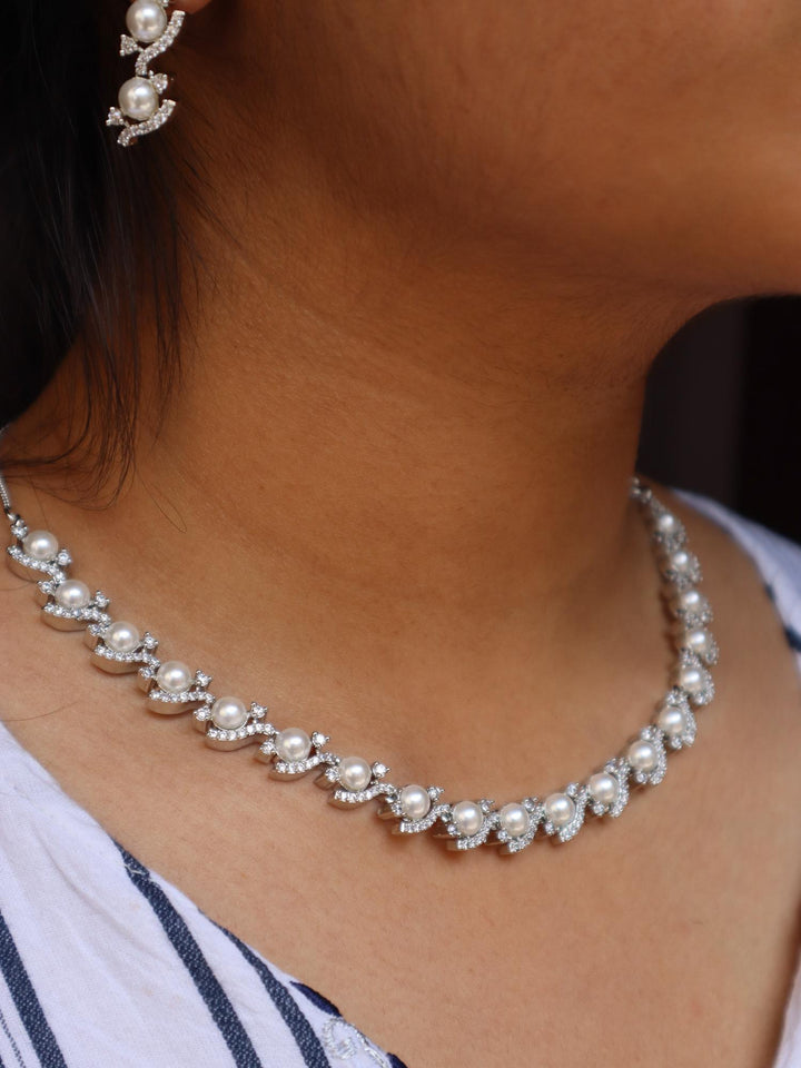 A closeup image of a girl wearing Nitara Pearl Necklace Set -1 by Live Some India 