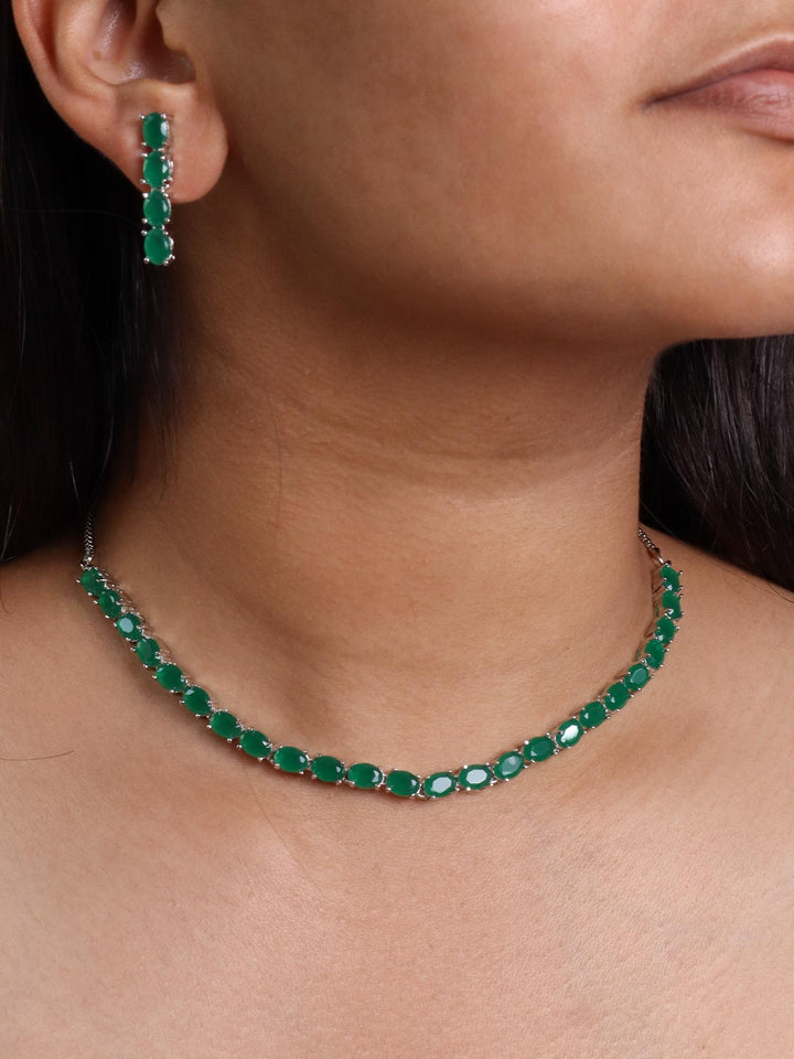 A closeup image of a girl wearing Oval Emerald Diamond Necklace Set -2 by Live Some India 