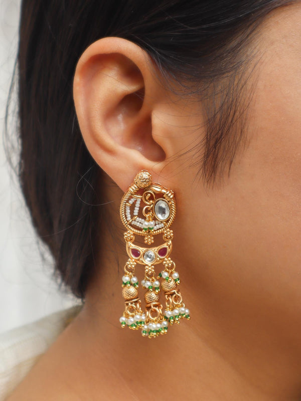 Girl wearing Oviya Temple Jewellery Dangle Earrings by Live Some India