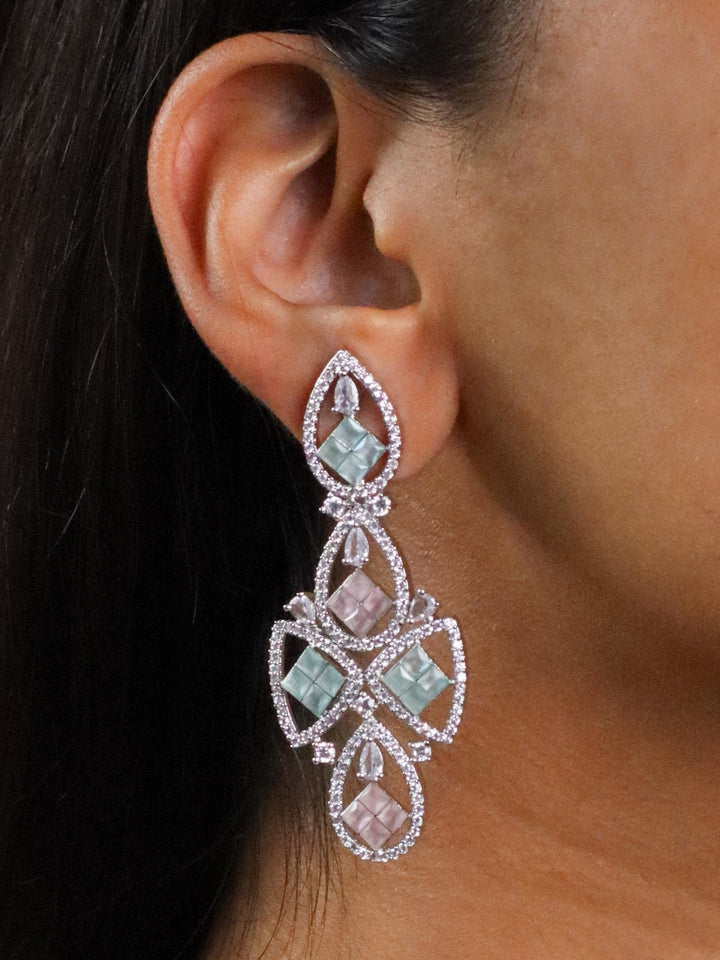 A closeup image of a girl wearing Pastel Love Diamond Earrings by Live Some India 