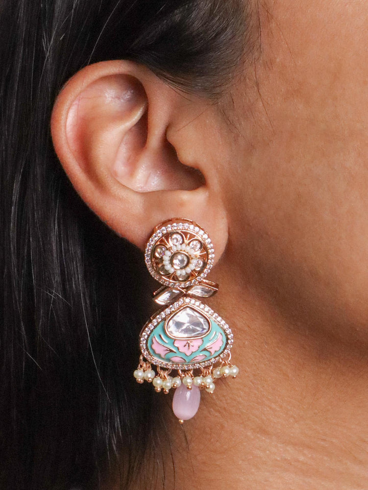 A closeup image of a girl wearing Pastel Reverie Kundan Polki Earrings by Live Some Inda 