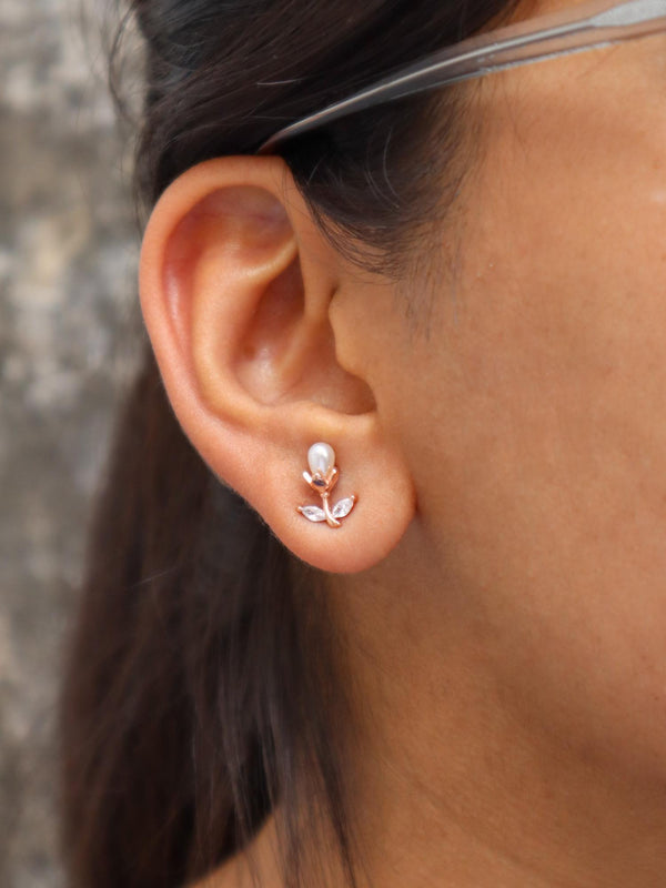 A closeup image of a girl wearing Pearl Bud Earrings by Live Some India 