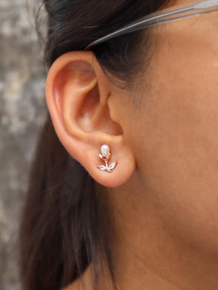 A closeup image of a girl wearing Pearl Bud Earrings by Live Some India 