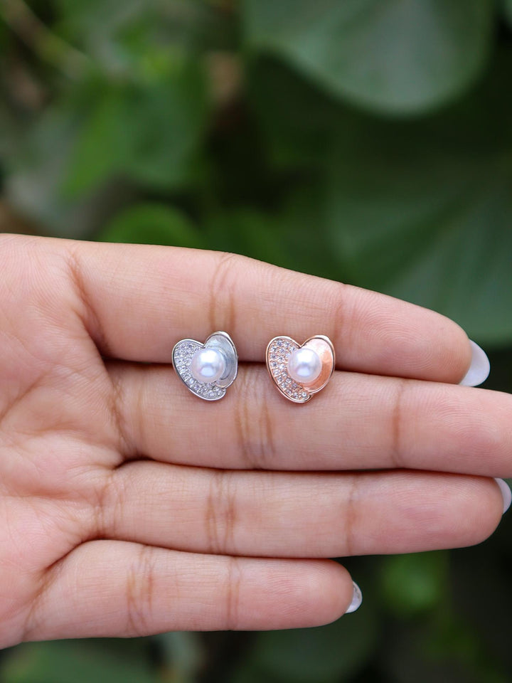 A closeup image of Pearl Centered Crystal Heart Earrings by Live Some India 