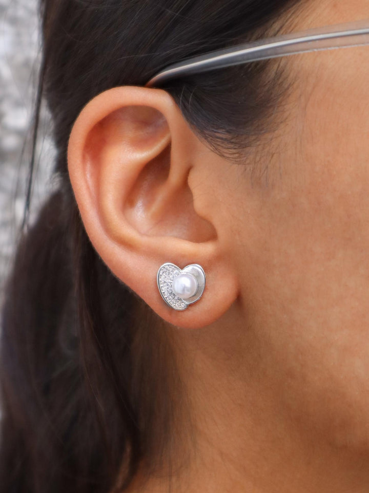 A closeup image of Pearl Centered Crystal Heart Earrings by Live Some India 