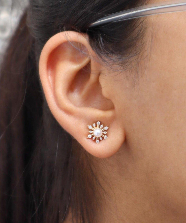 A closeup image of a girl wearing Pearl Shine Earrings by Live Some India 