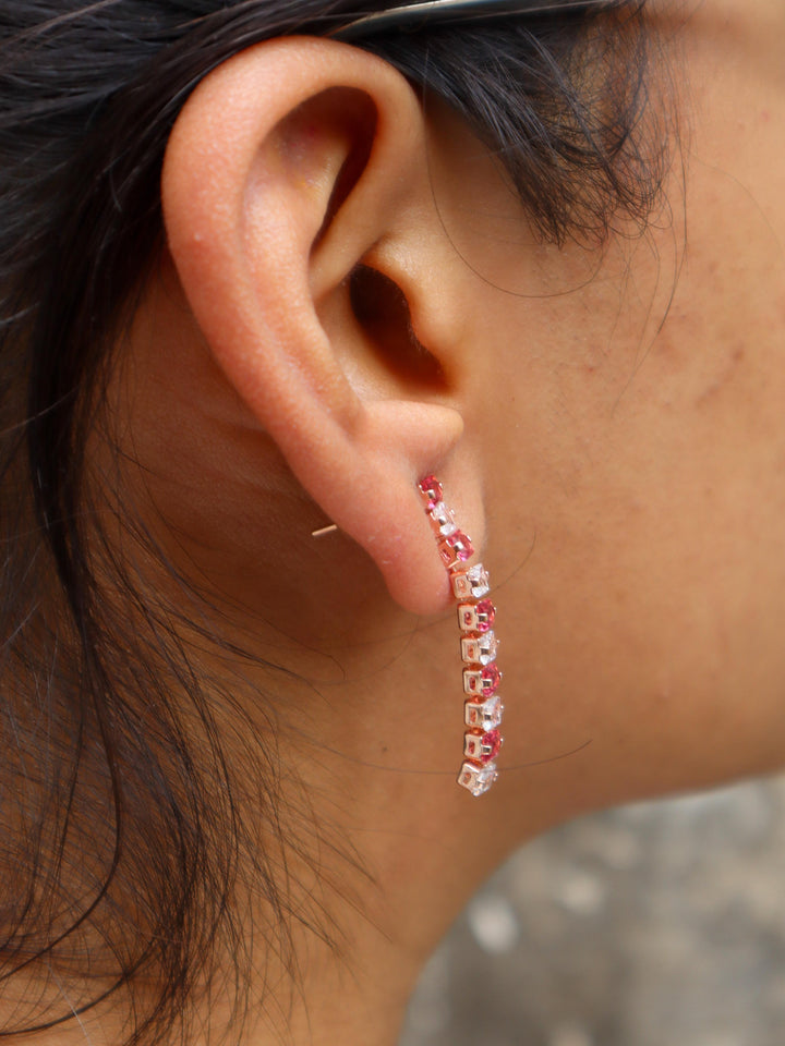 A closeup image of a girl wearing Pink Dimension Earrings -1 by Live Some India 