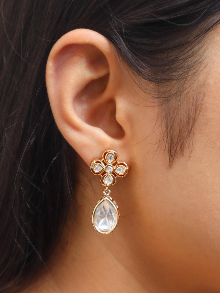 Girl wearing Poornabh Kundan Polki Dangle Earrings by Live Some India