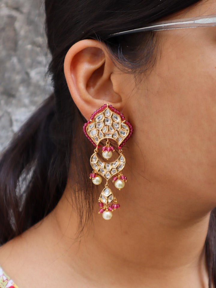 A closeup image of a girl wearing Ritu Kundan Polki Dangler Earrings -1 by Live Some India 