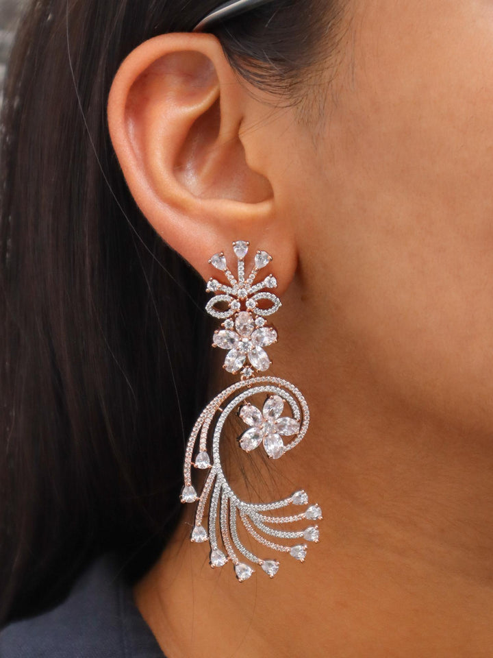 A closeup image of a girl wearing Sparkle Diamond Earrings by Live Some India 