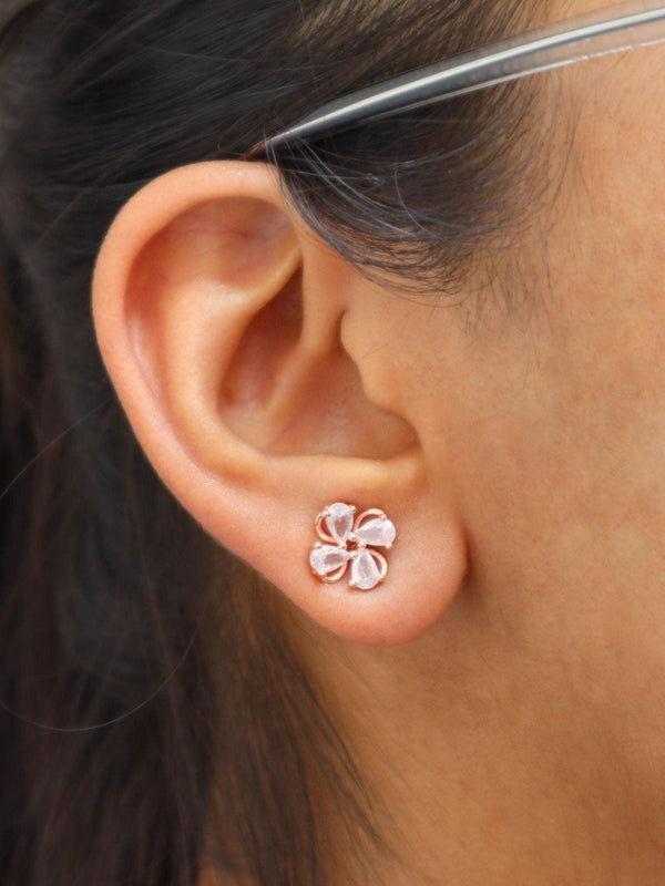 A closeup image of Rose Gold Crystal Floral Earrings by Live Some India 