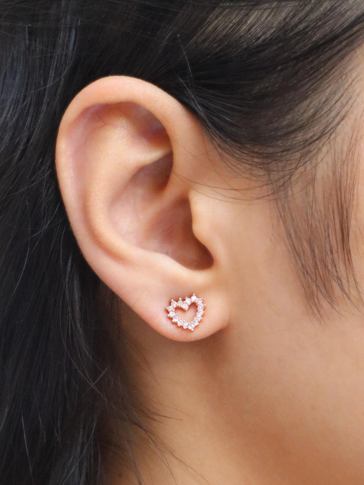 Girl wearing Rose Gold Diamond Heart Earrings by Live Some India