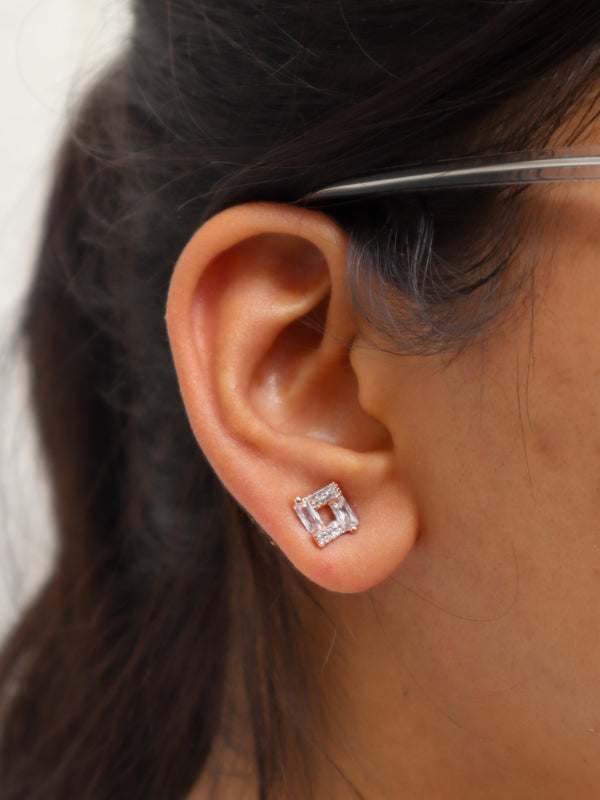 A closeup image of a girl wearing Rose Gold Squared Earrings by Live Some India 