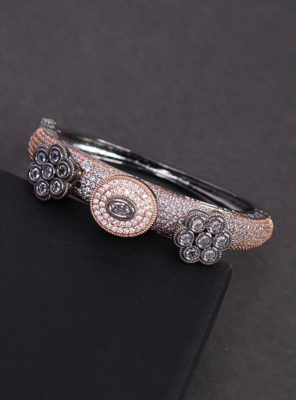 A closeup image of Rose Gold Studded Contemporary Bracelet -1 by Live Some India on a black background