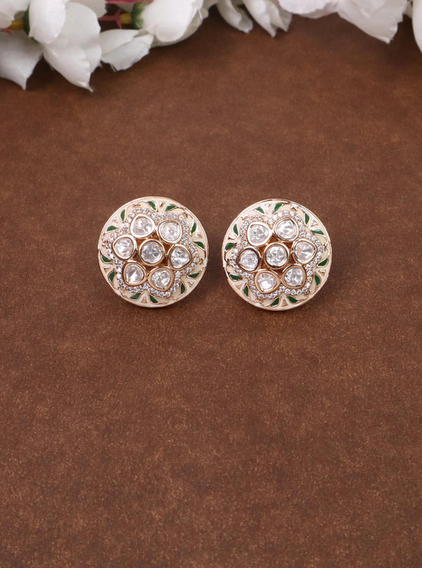 A closeup image of Round Unique Green Meenakari Kundan Polki Stud Earrings by Live Some India on a brown background 