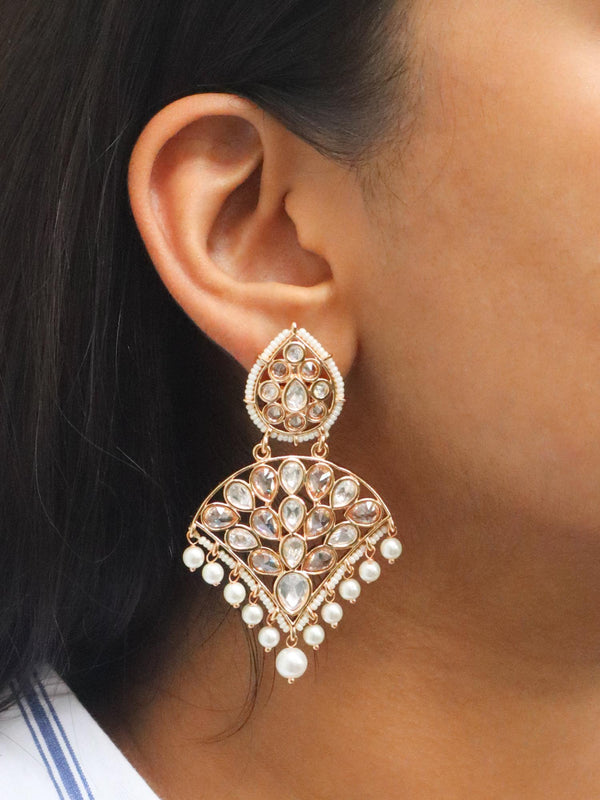 A closeup image of a girl wearing Royal Essence Diamond Earrings -1 by Live Some India 