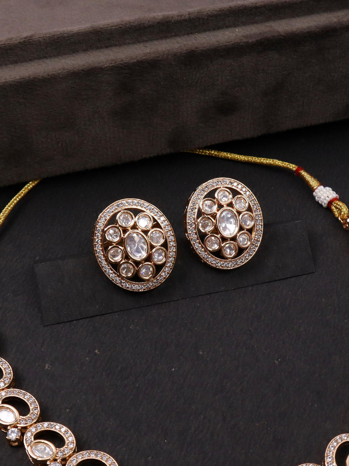 A closeup image of Royal Kundan Polki Earrings by Live Some India on a black background