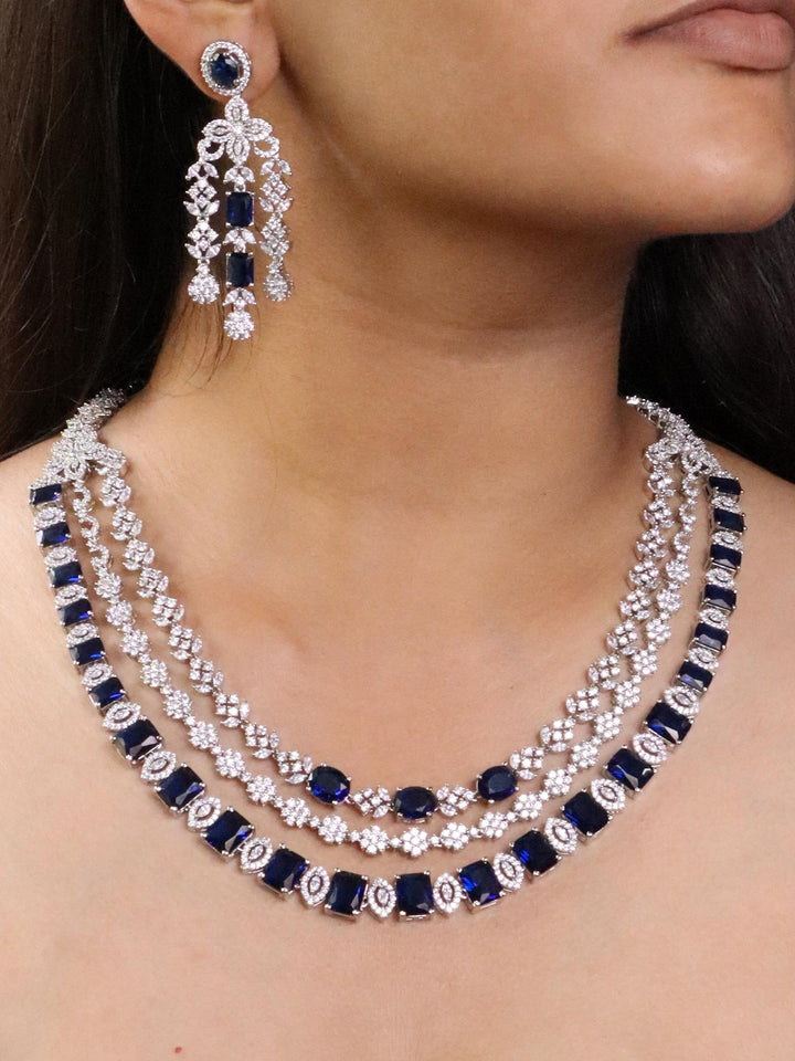 A closeup image of a girl wearing Royal Sapphire Diamond Necklace Set by Live Some India 