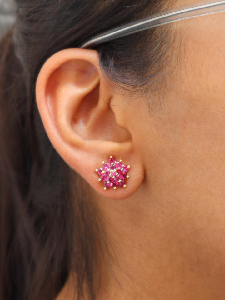 A closeup image of Ruby Dual flowers with Golden Beads Earrings by Live Some India 