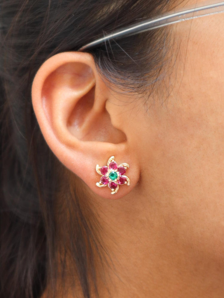 A closeup image of Ruby Golden Floral Earrings by Live Some India 