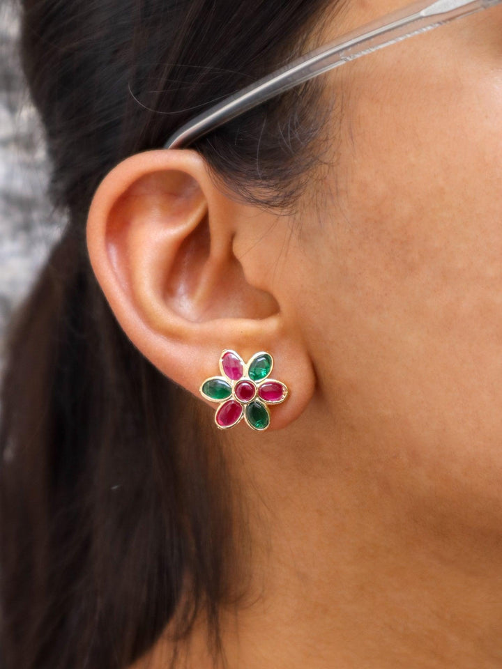 A closeup image of Ruby and Emerald Floral Earrings by Live Some India 