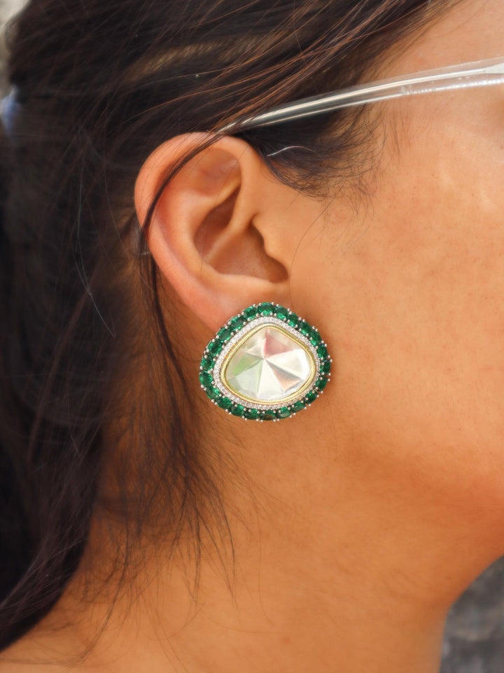 A cloeup image of a girl wearing Saanvi Kundan Polki Stud Earrings by Live Some India 