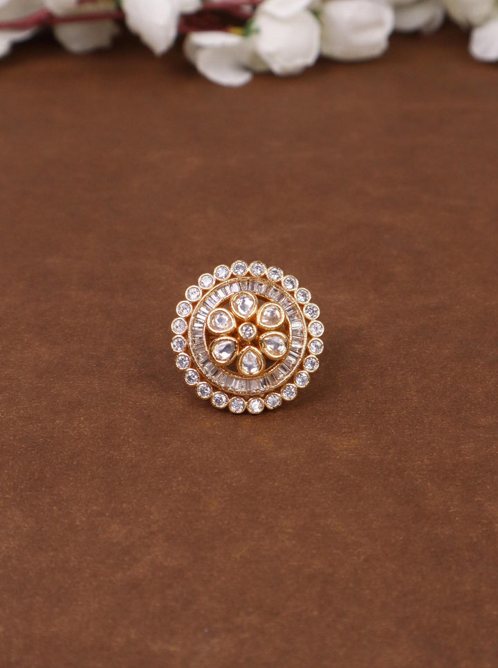 A clsoeup image of Saira Kundan Polki Ring -1 by Live Some India on a brown background 