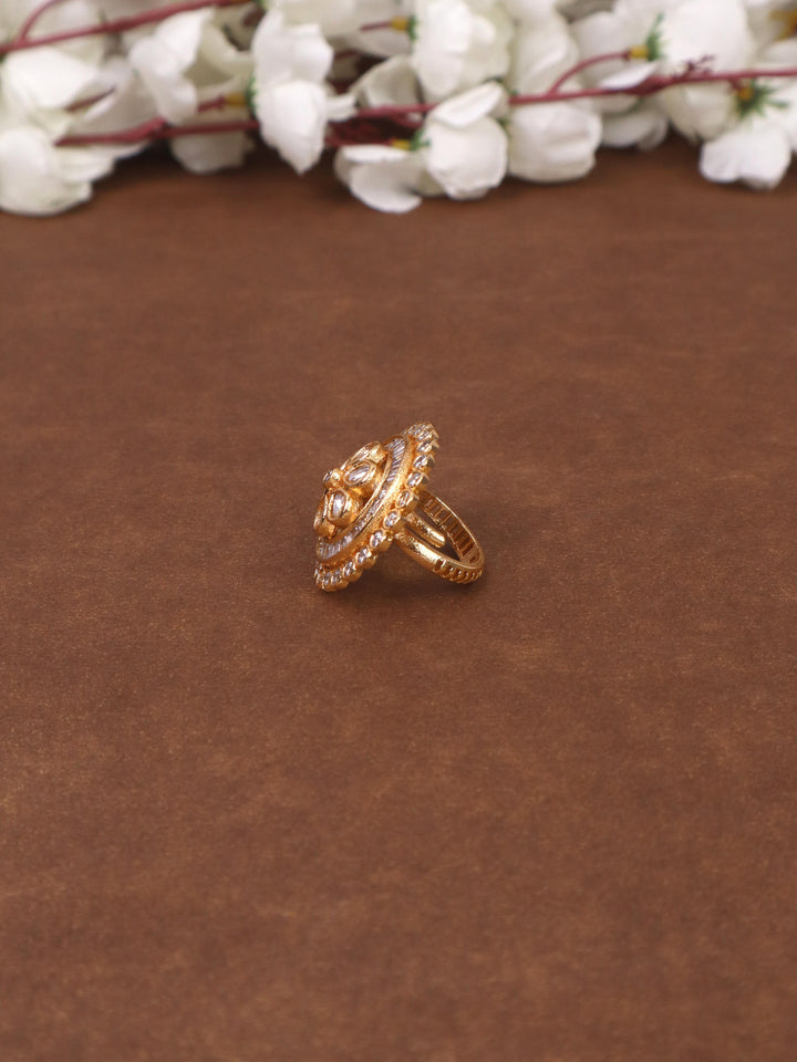 A closeup image of Saira Kundan Polki Ring -2 by Live Some India on a brown background 