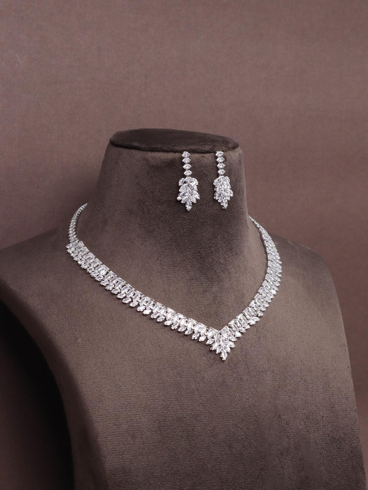 A closeup image of Samaira Diamond Necklace Set -2 by Live Some India on a brown dummy 