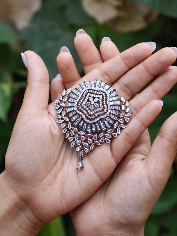 A closeup image of a girl holding Shimmer Studded Contemporary Pendant Set by Live Some India 