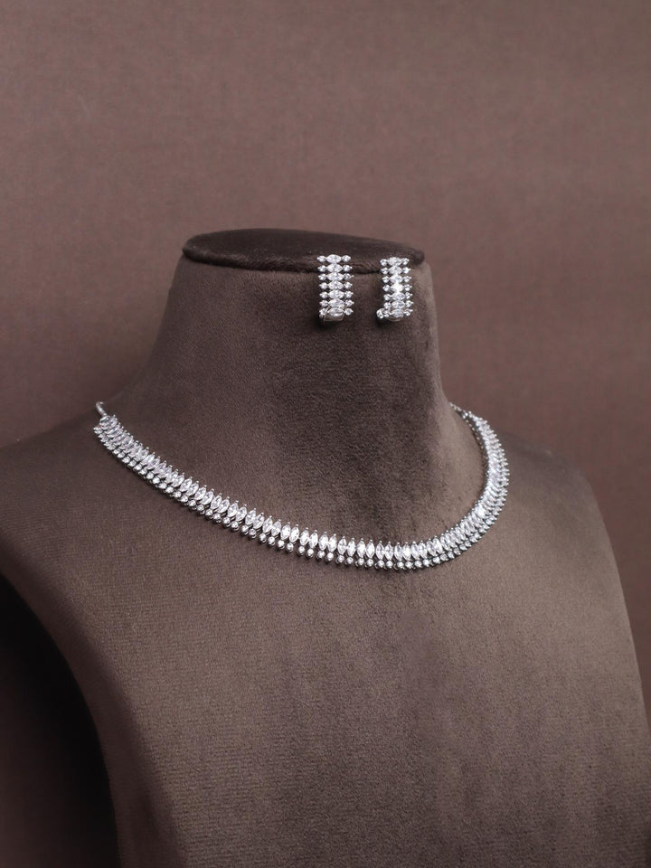 A closeup image of Shine Diamond Necklace Set by Live Some India on a brown dummy 