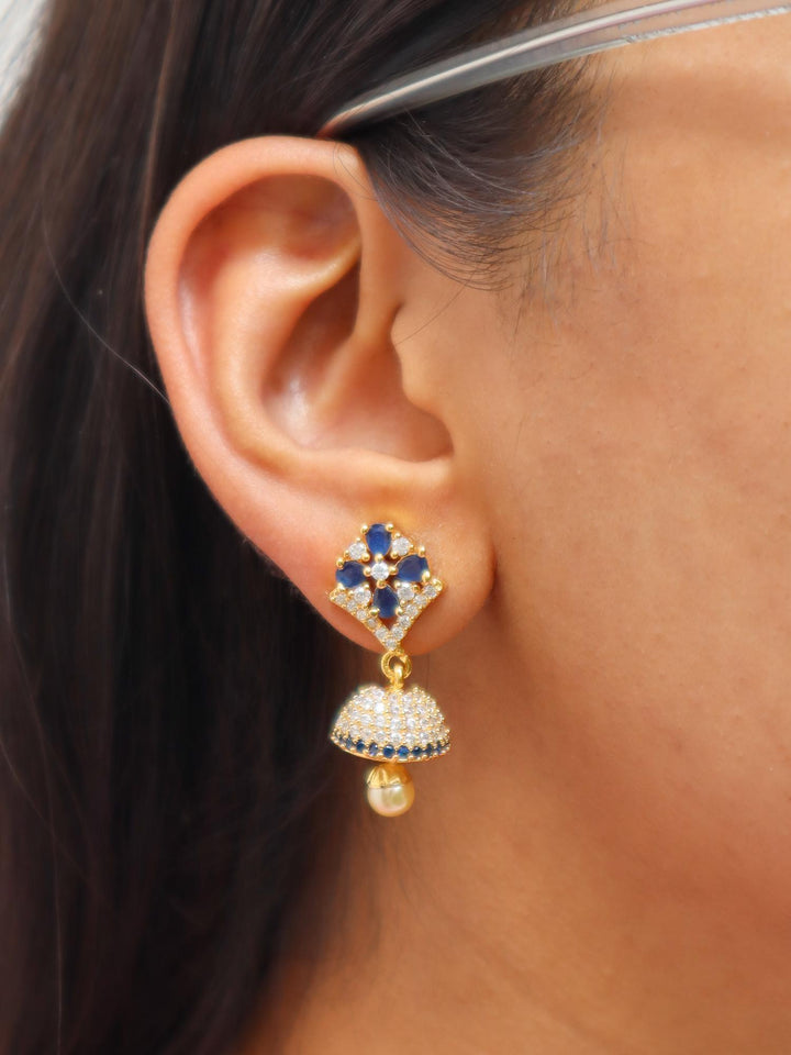 A closeup image of Shiny Floral Kundan Polki Jhumka Earrings by Live Some India 