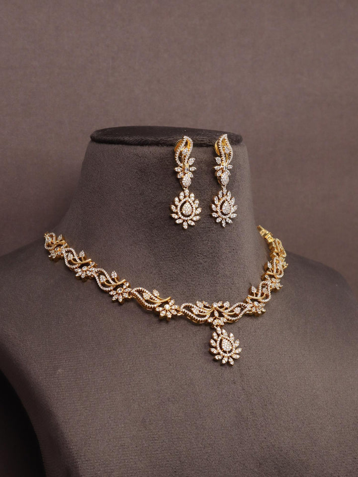 A closeup image of Shloka Diamond Necklace Set by Live Some India on a brown dummy 